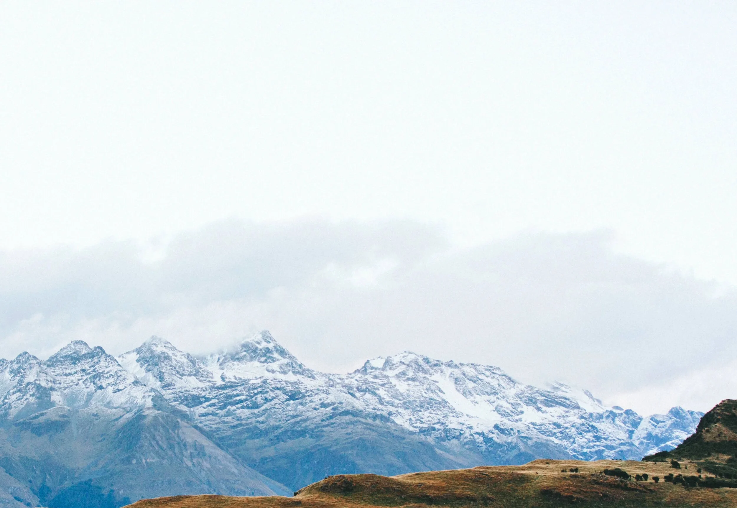 Snow-covered mountain peaks with a clear sky above