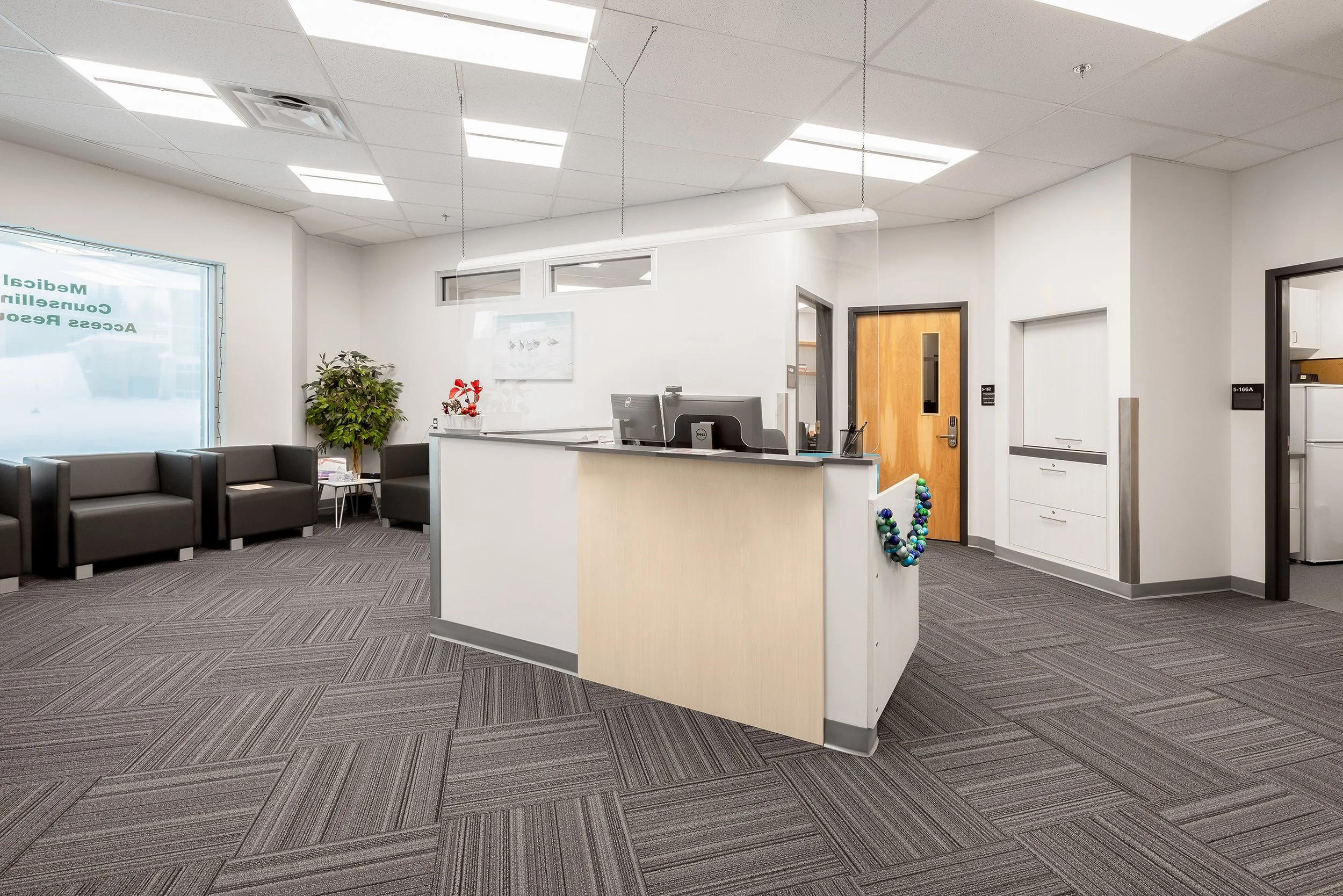  Medical office assistant desk and waiting area. 