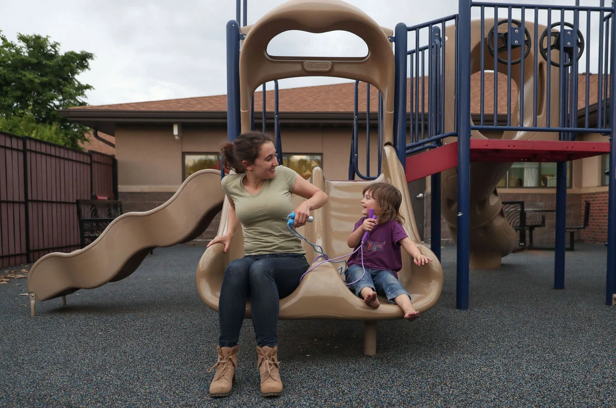 Angela, who volunteers as a BUDDY in our program, plays with a three-year old child who currently lives at MICAH House with her family. The BUDDY Program is one of the many services offered to families during their stay.