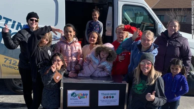 The Girl Scouts of Troop 64224, seen here with Beth Shelton, CEO of Girl Scouts of Greater Iowa, sold more than 5,000 cookies, even though the girls live in an emergency shelter.