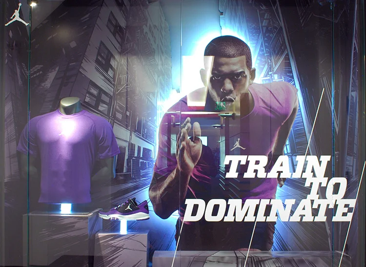 Displays featuring cityscape illustrations for the Nike "Dominate Training" campaign, featuring Chris Paul.