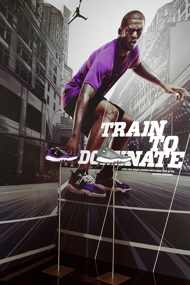 Displays featuring cityscape illustrations for the Nike "Dominate Training" campaign, featuring Chris Paul.