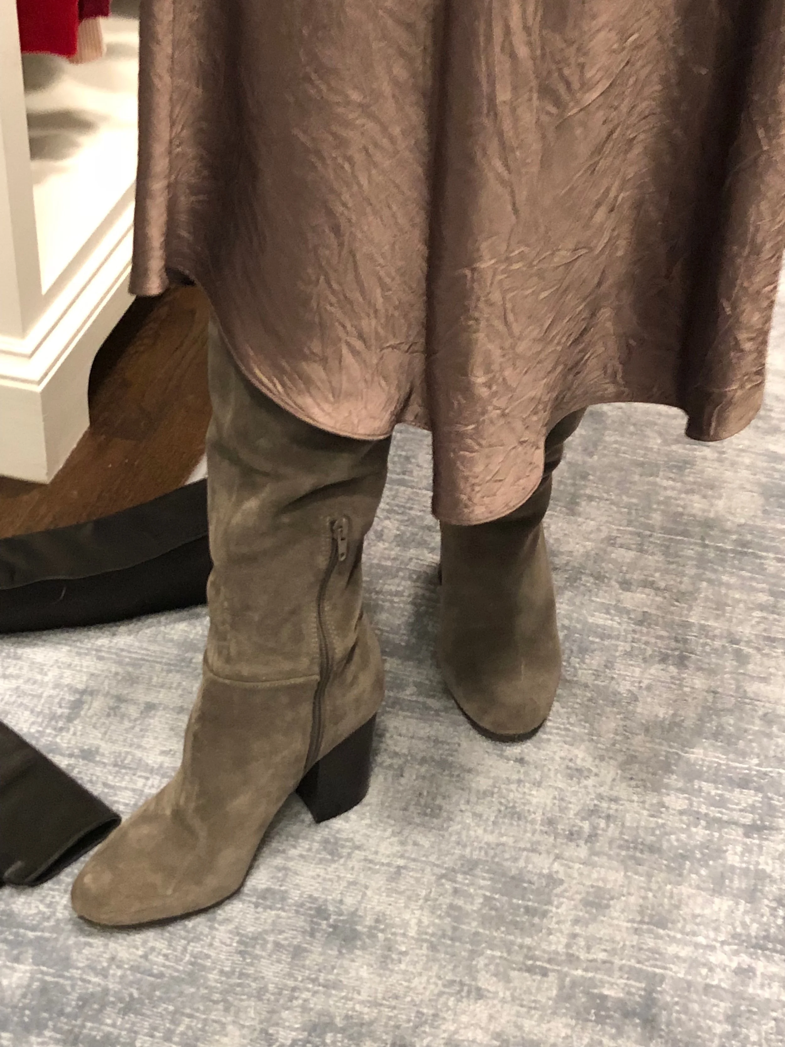 The skirt hangs over the boot