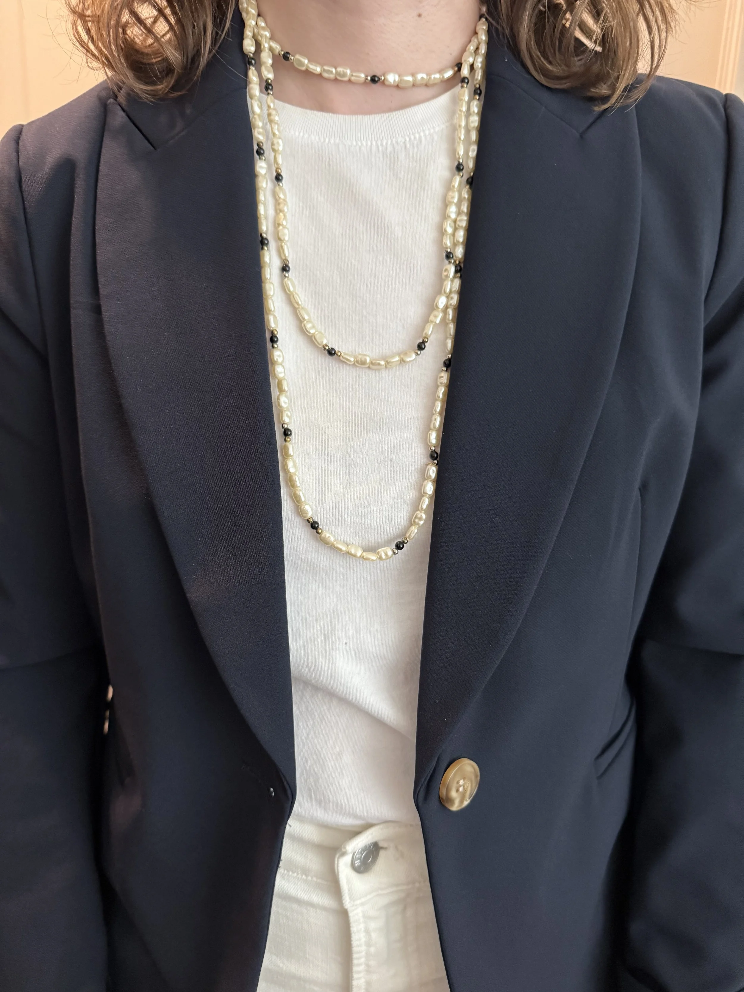 1 necklace draped in 3 graduated lengths