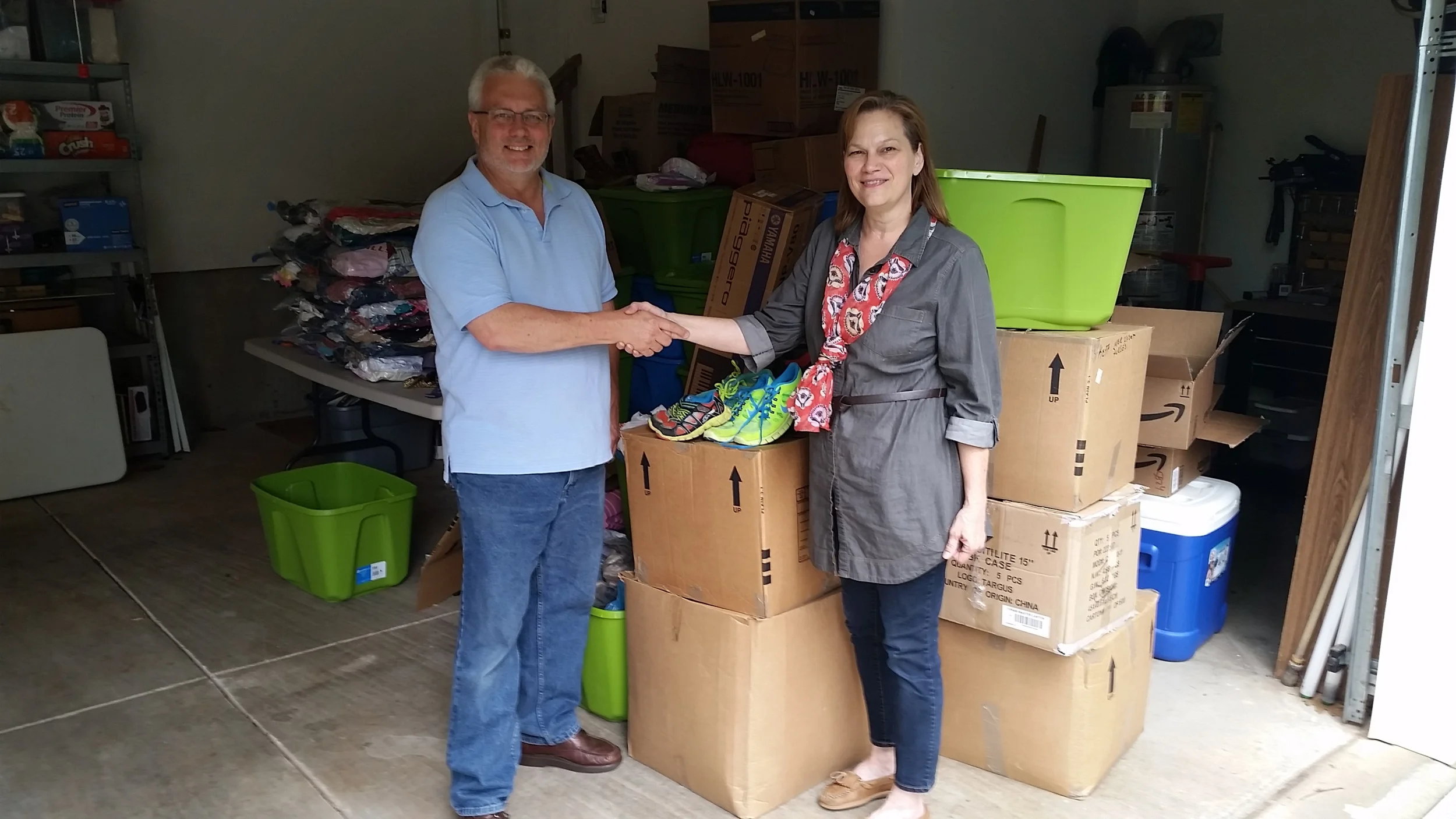 Gale Keef, Interact club adviser at Liberty Prep, delivers the shoes!
