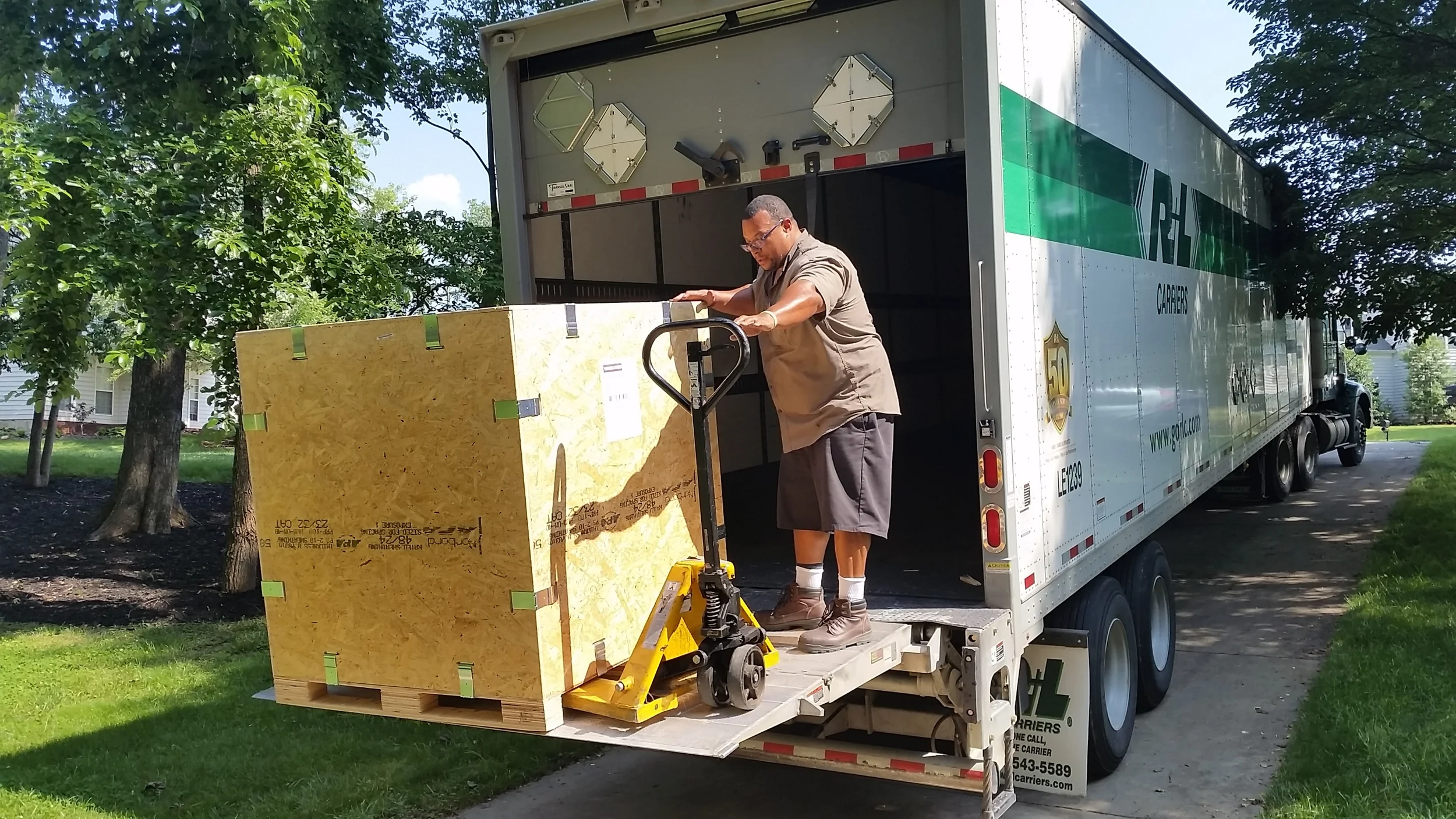 Getting the crates loaded onto the truck on our sloped driveway was exciting for truck driver, Tony!