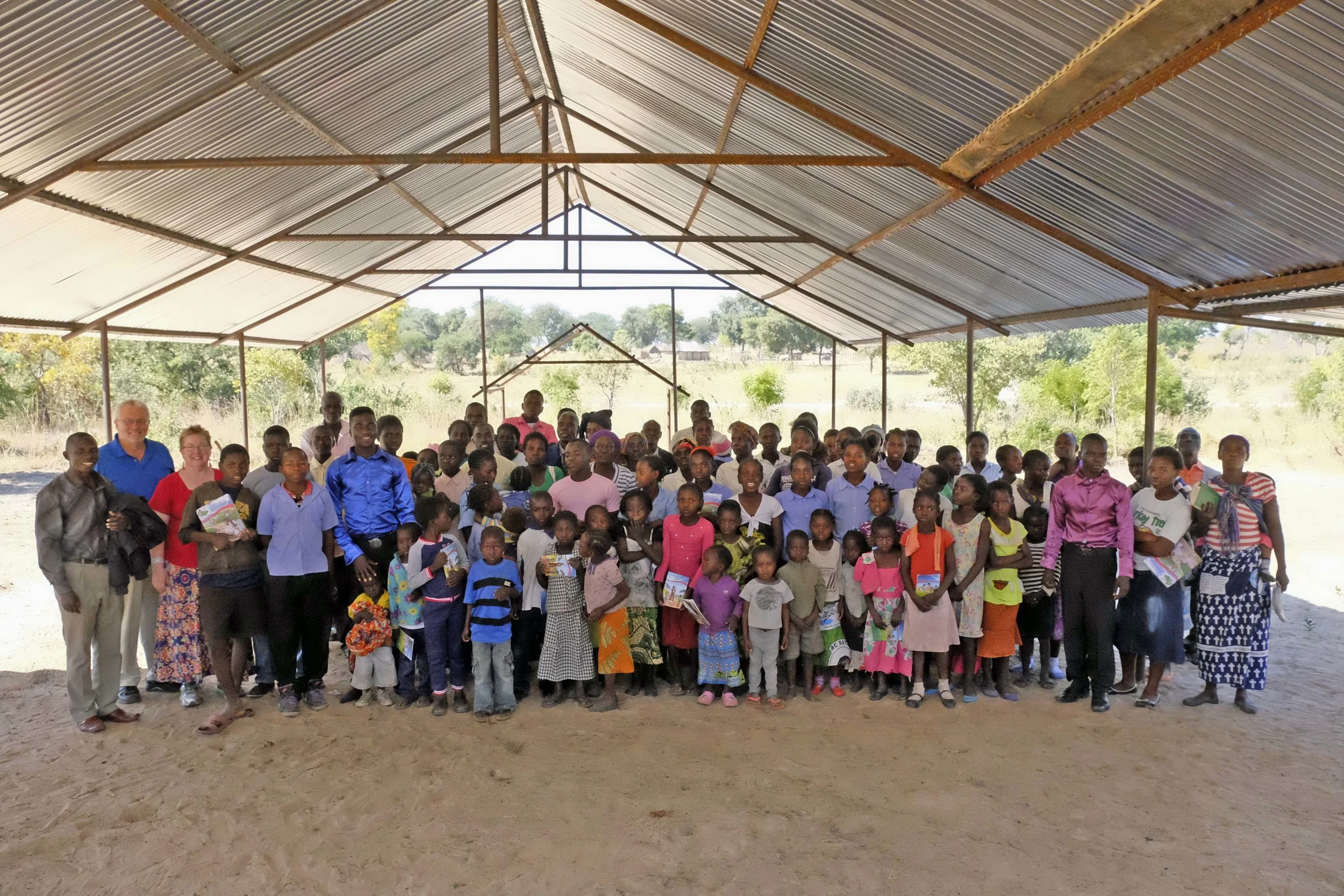 Lilonga Evangelical Church of Zambia (L to R, Pastor Moses Yamba, Doug and Abby)