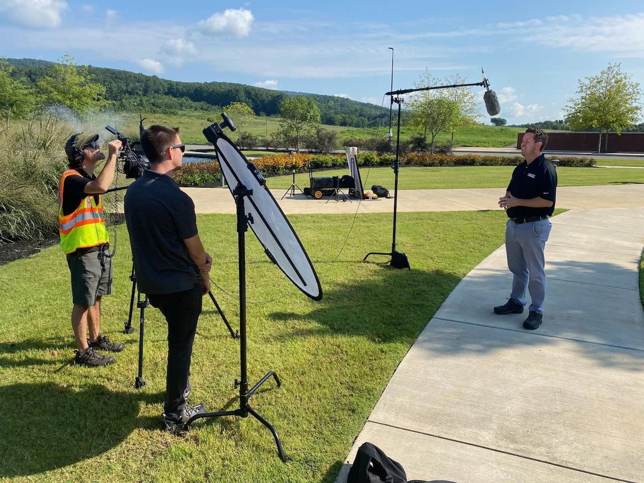 Camera Operator Capturing Interviews - 6 STRONG MEDIA