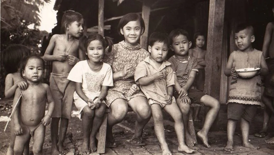 The Sudhinaraset Family and Neighborhood Kids in Thailand 1960.