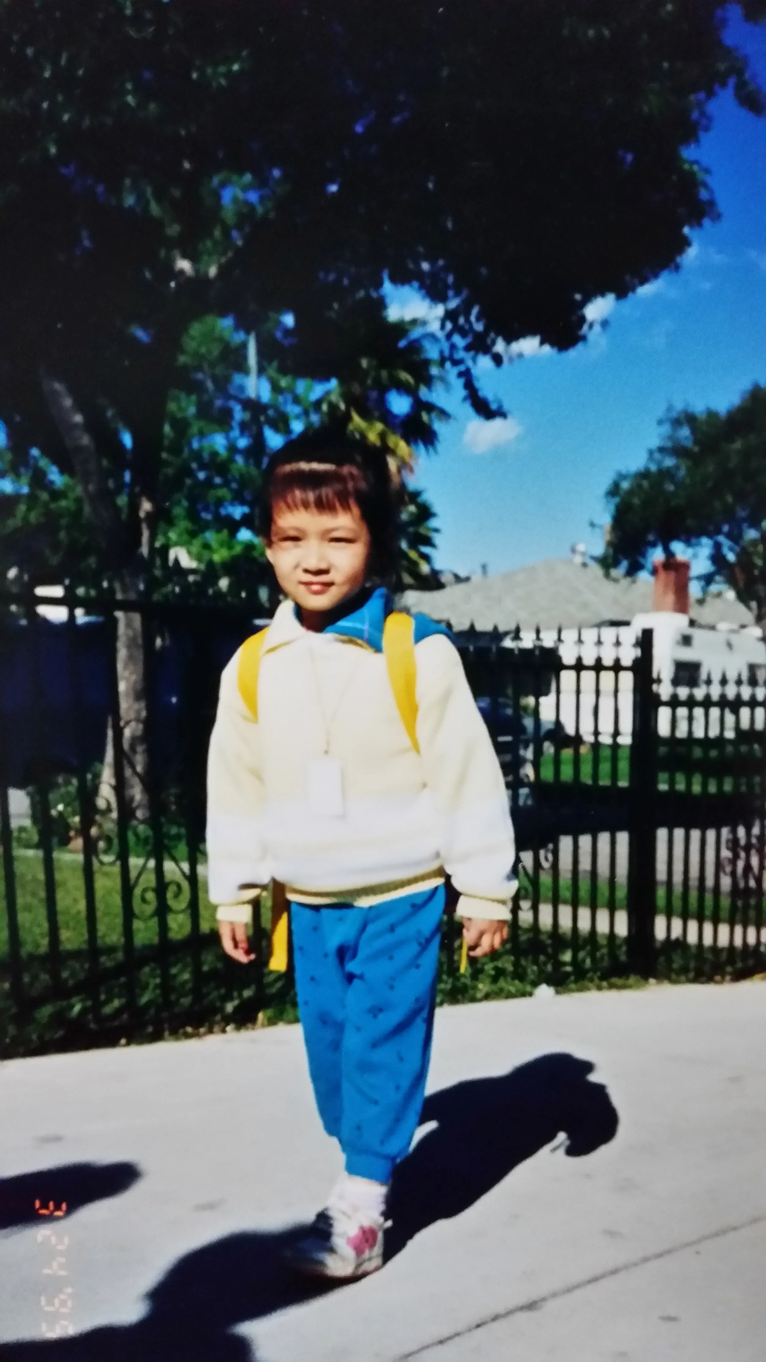 Heading home from school, fully decked in 90s attire.