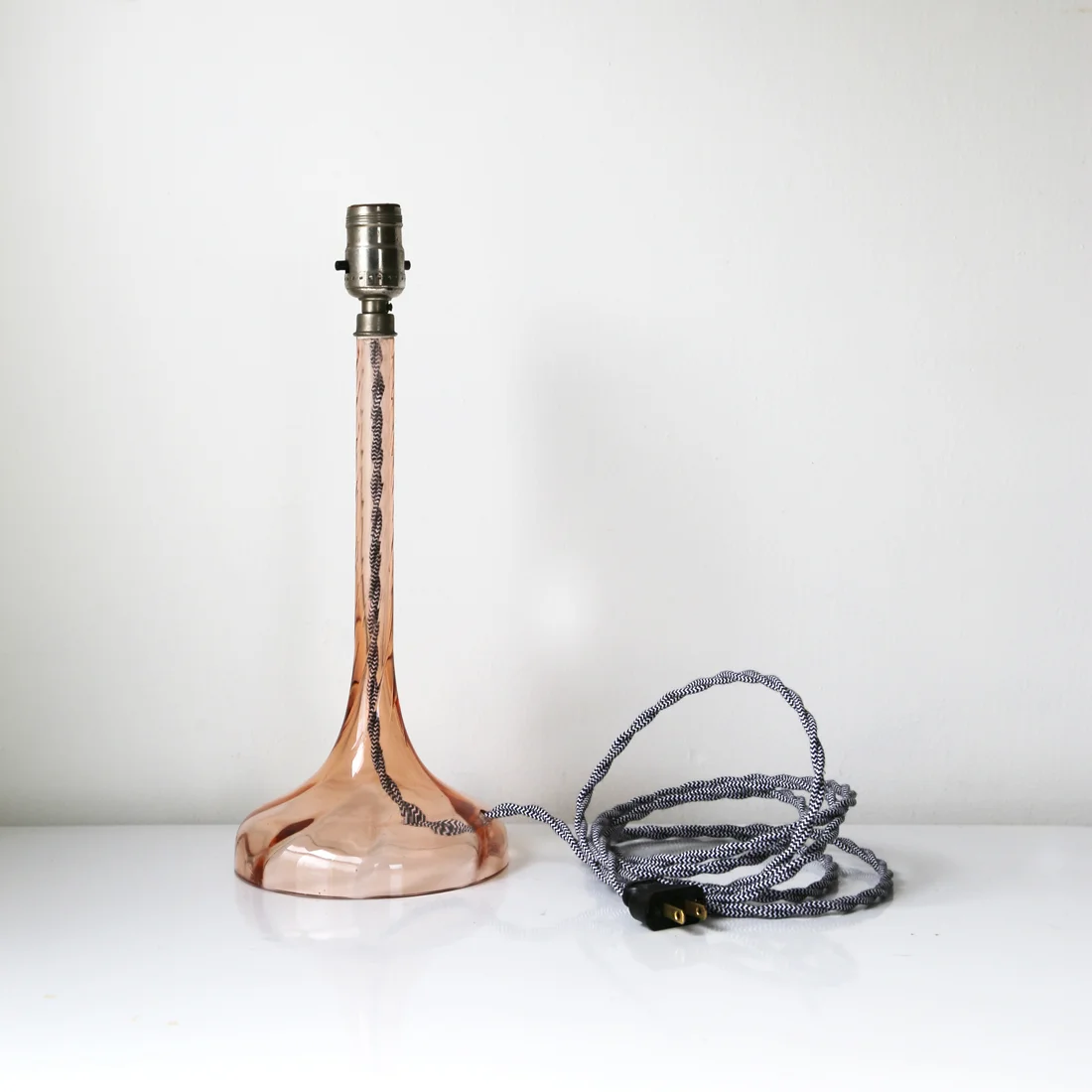 Antique pink depression glass lamp with black and white cloth cords // courtney dawley // found by a prop stylist