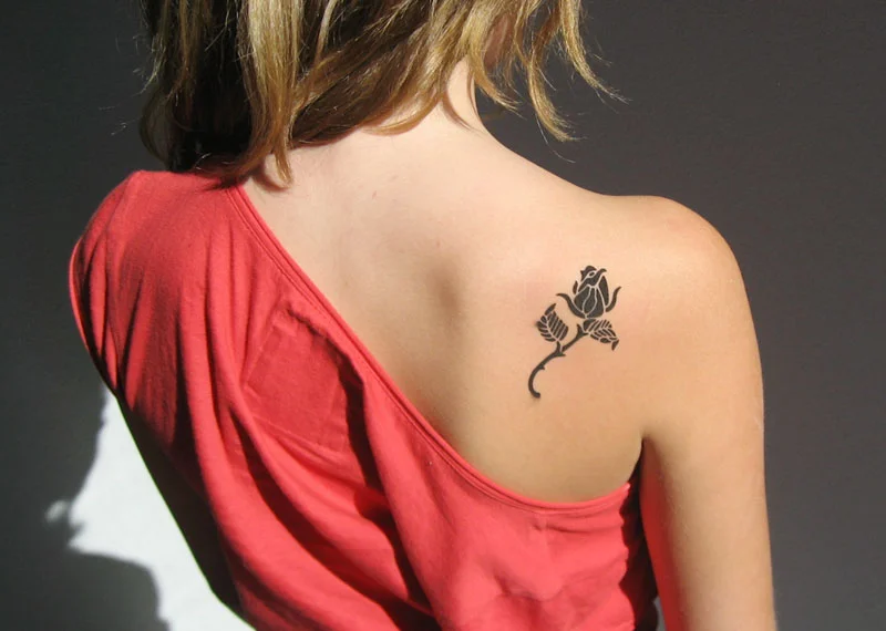woman with rose tattoo