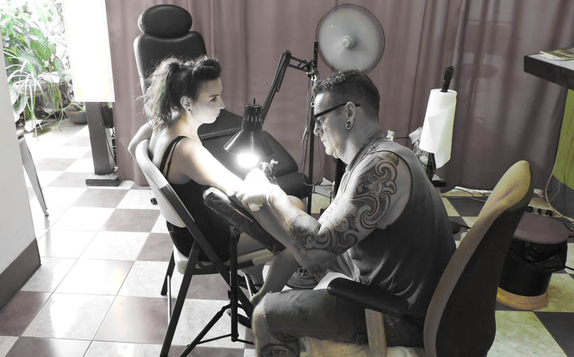 woman getting a tattoo