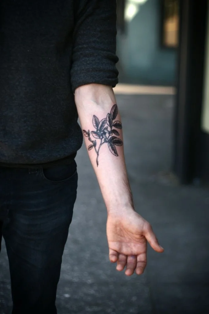 olive leaves arm tattoo