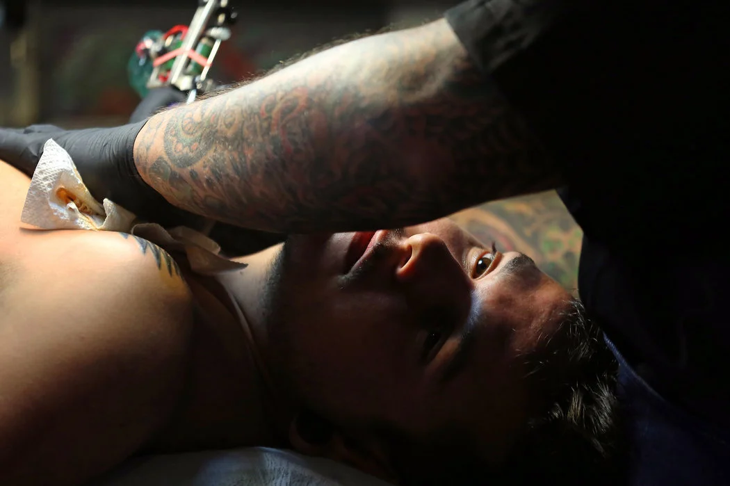 tattoo session in progress