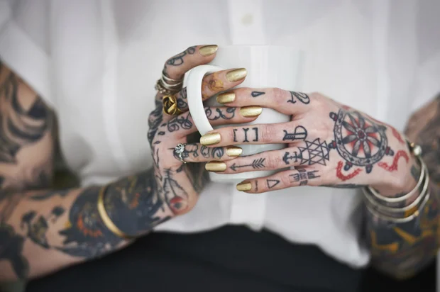 woman's hands and arms with tattoo