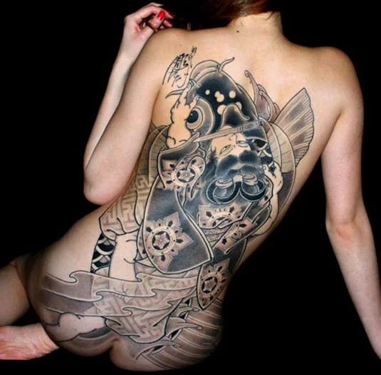 black and grey back tattoo