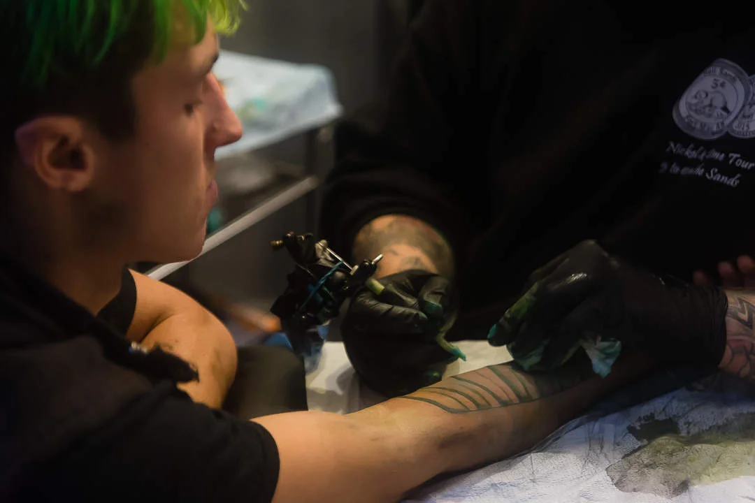 tattoo session in progress