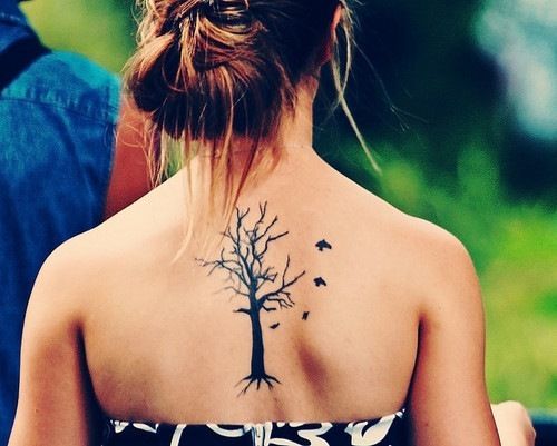 woman with a back tattoo