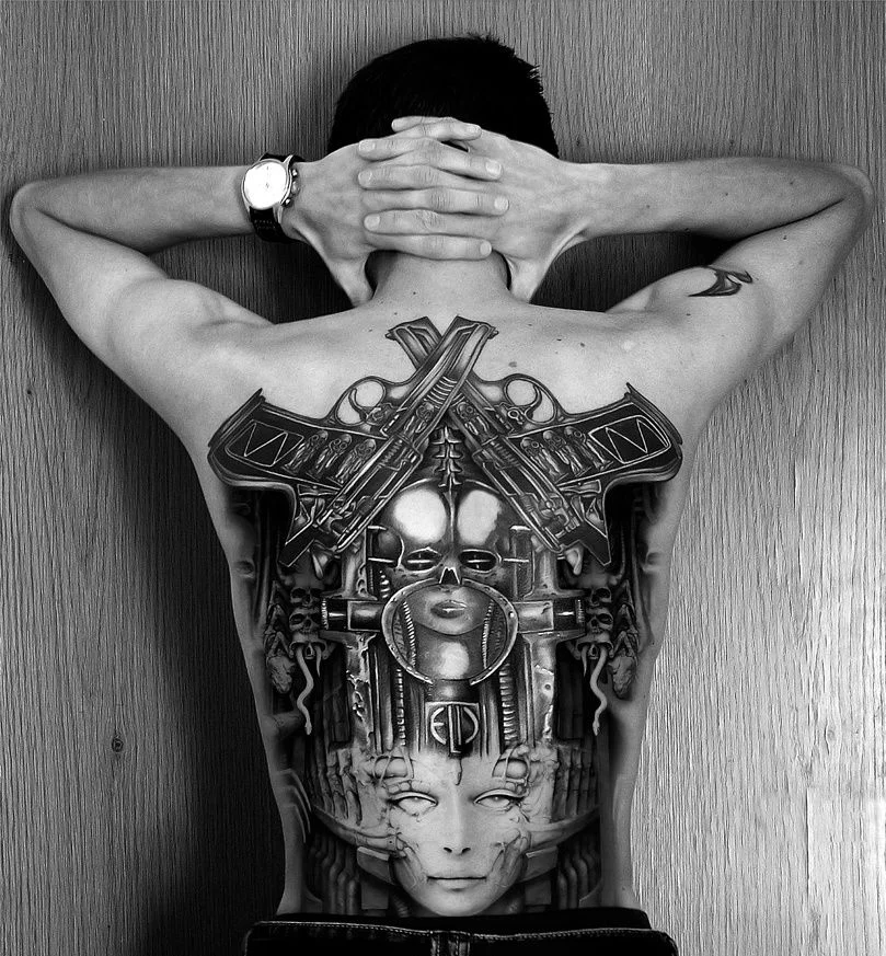 man with large back tattoo