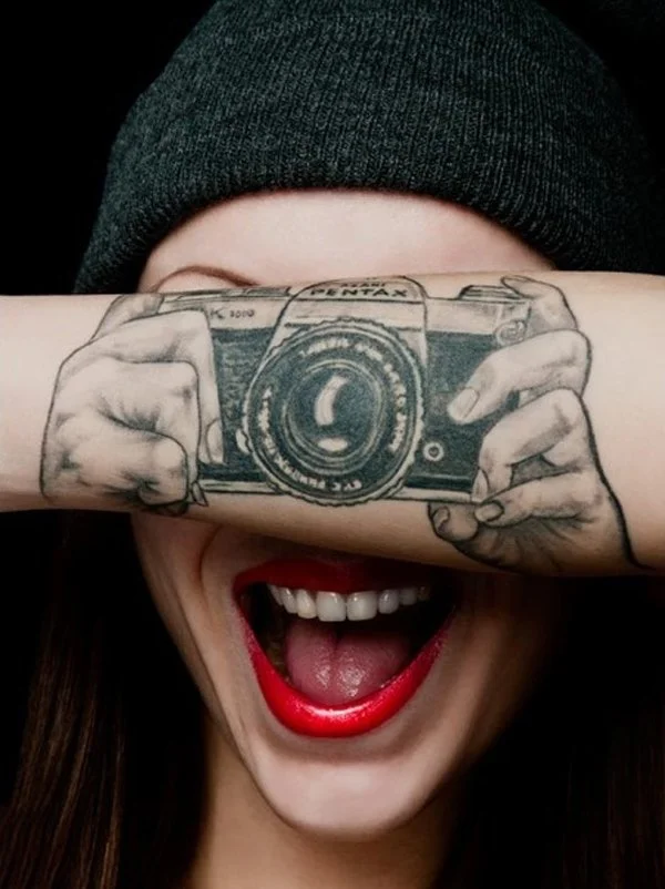 happy woman with arm tattoo