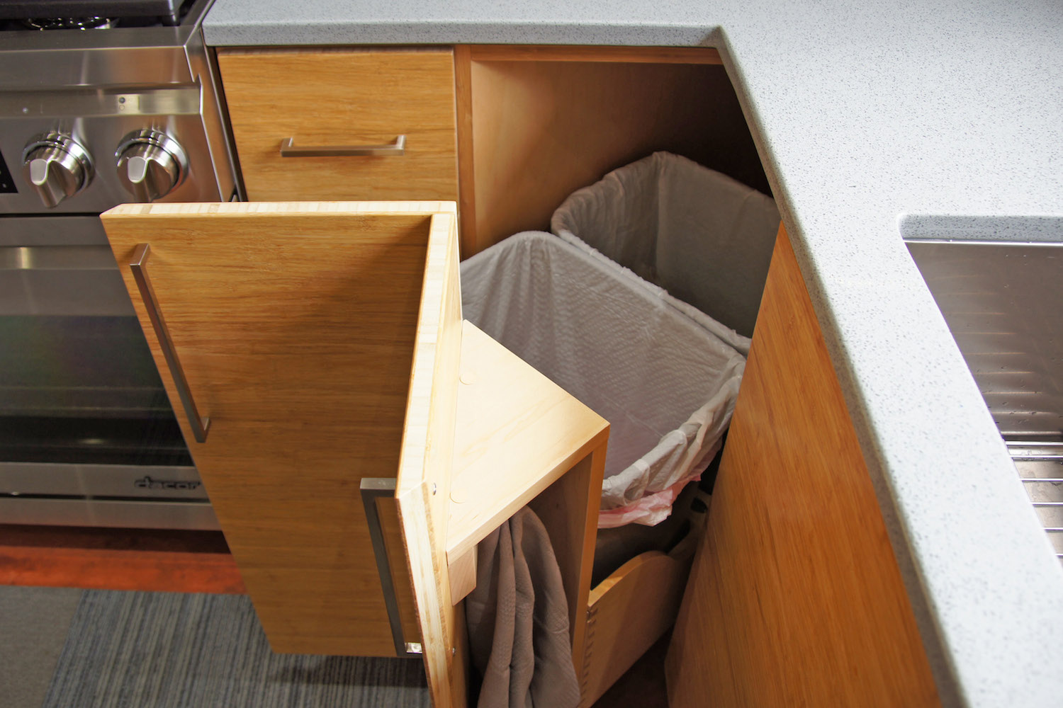 04 corner trash pull out and towel storage.jpg