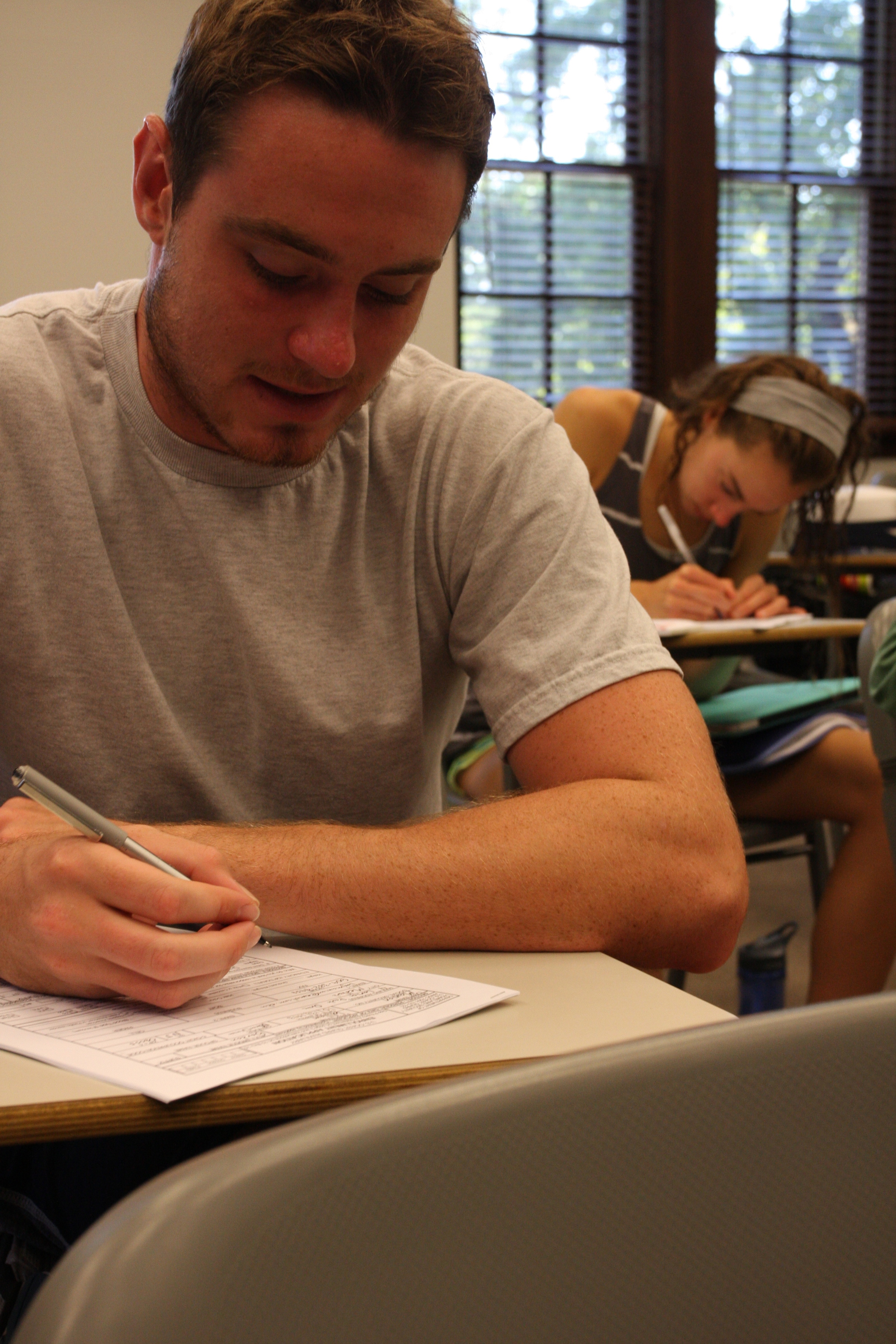  William Manion and Julianne Abruzzo fill out new member applications at the College of William and Mary in Williamsburg, Va., Sept. 8, 2013. AUP Unit William and Mary hosts an annual Basic Introductory Course Weekend to give potential new members a 