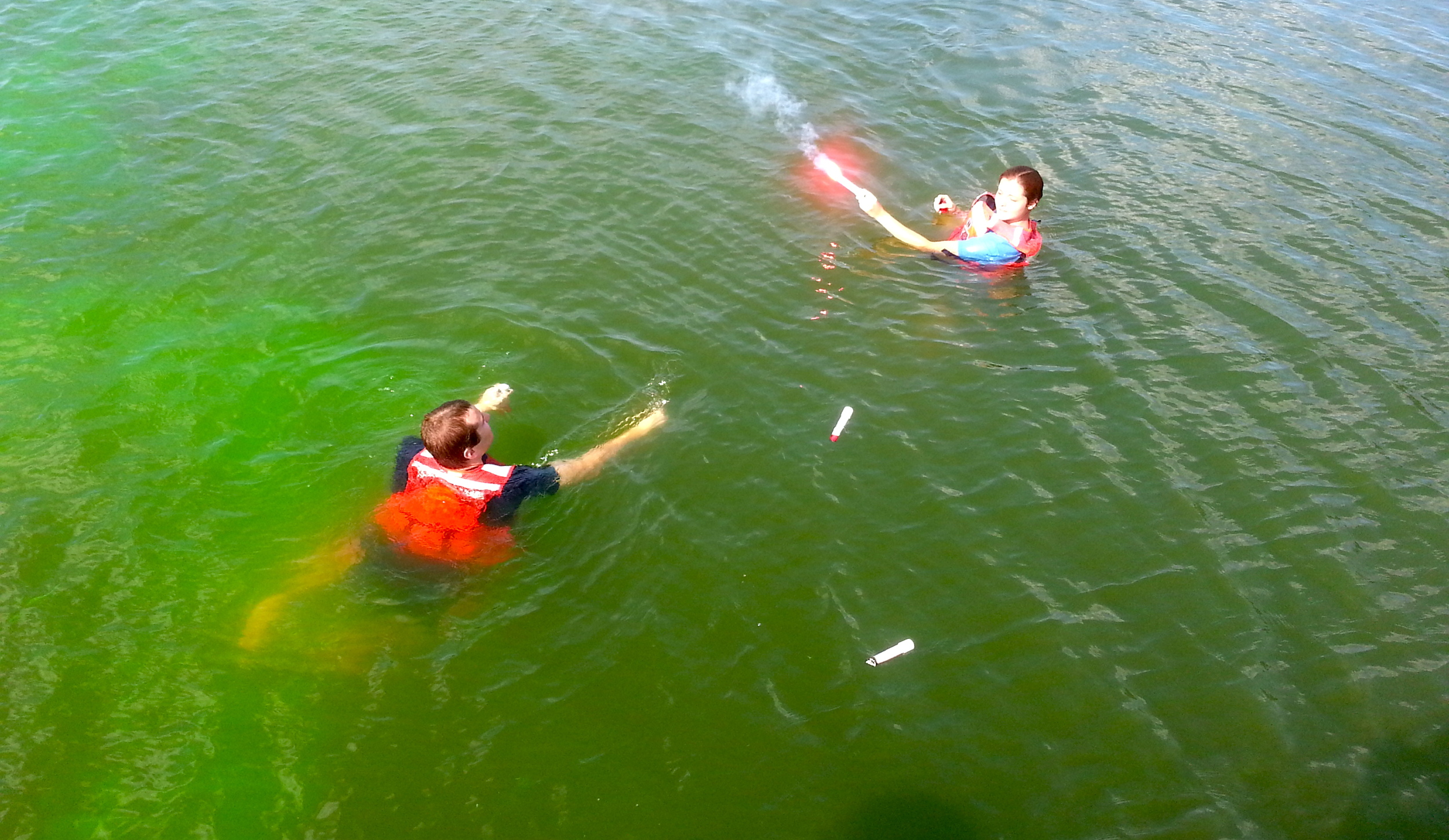  Wingler, on right, participates in a flare and dye marker exercise at Coast Guard Station Milford Haven, Va. U.S. Coast Guard photo by auxiliarist Stephanie Hutton. 