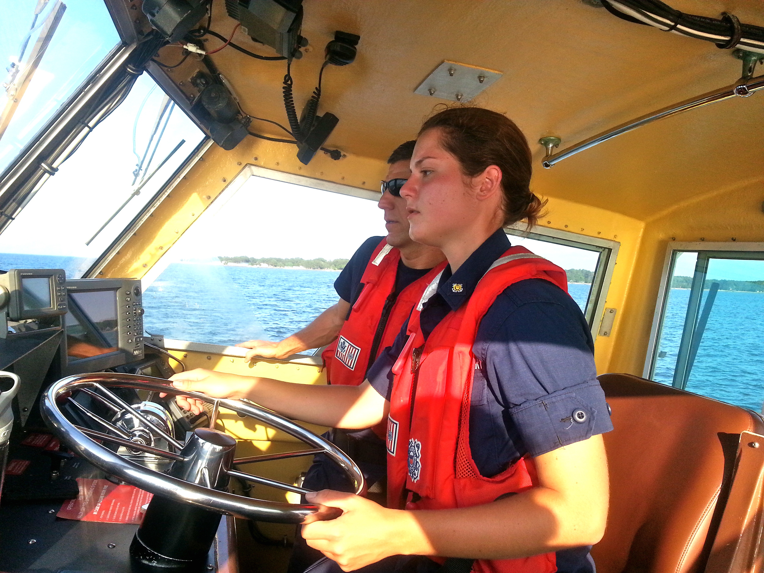  Wingler drives the 41-foot Utility Boat at Coast Guard Station Milford Haven, Va. under the supervision of Chief Petty Officer Dickinson. U.S. Coast Guard photo by auxiliarist Stephanie Hutton. 