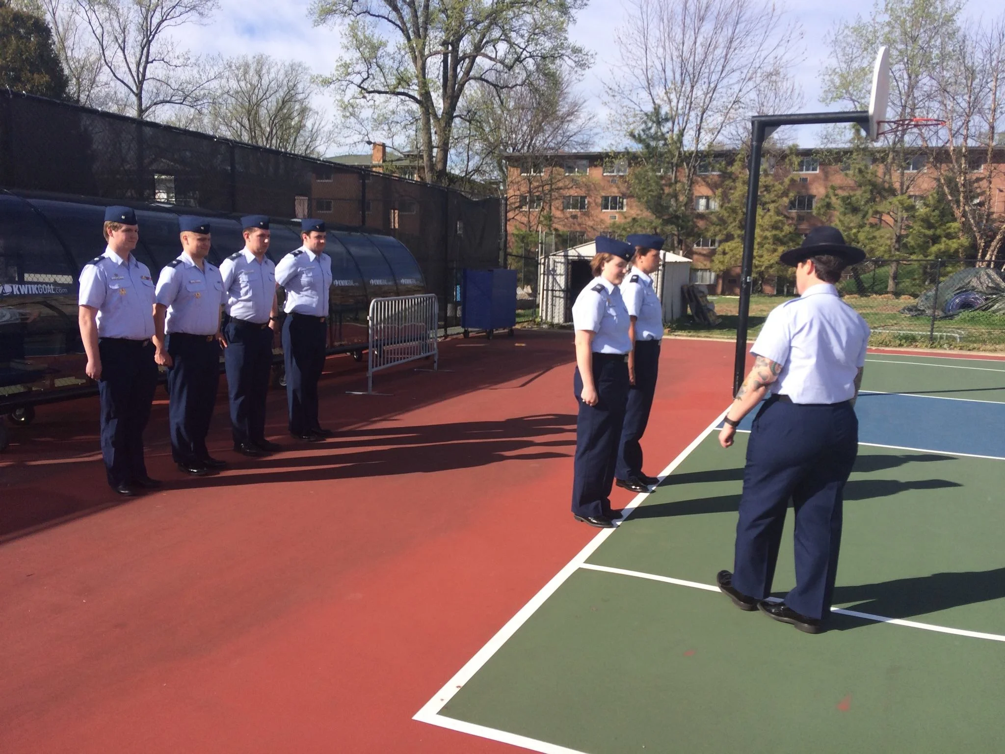 Members of the United States Coast Guard Auxiliary University Program receive drill from Company Commander MKC Reid at American University.
