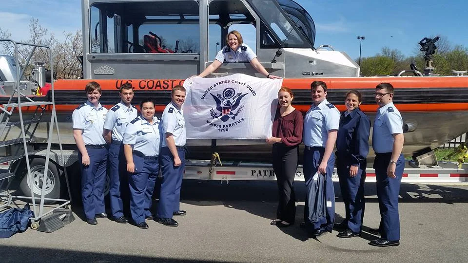 Members of the Auxiliary University Program in front of a 29' Response Boat Small at Station Washington.