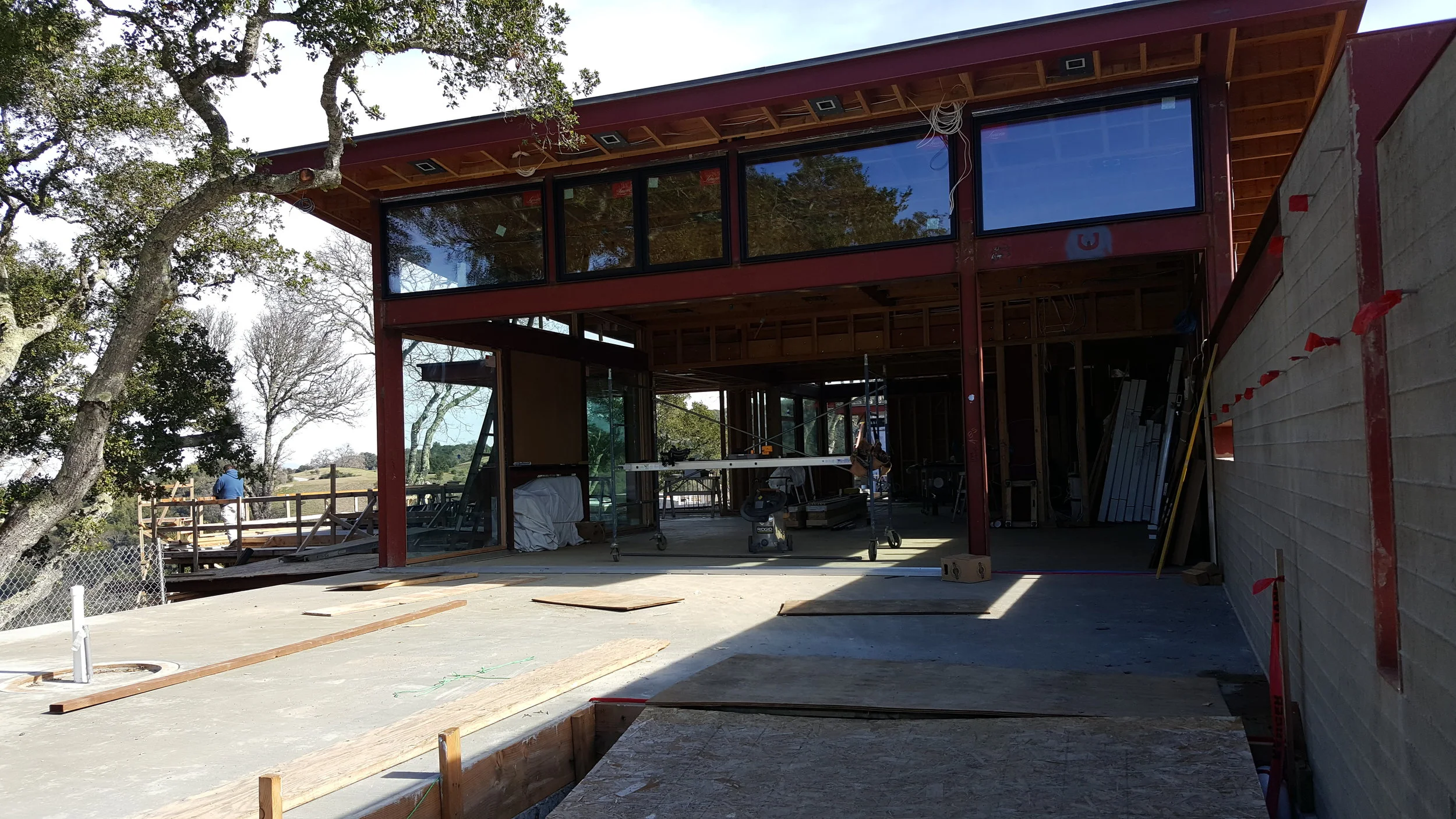 house with red structure under construction