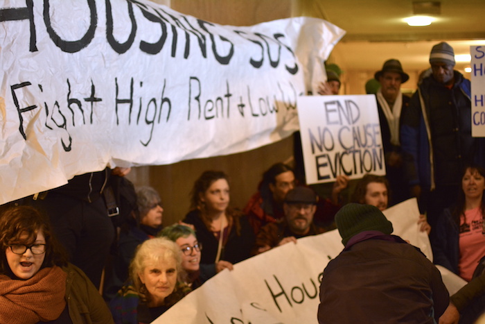 Protestors blocked the entrance to the Governor Kate Brown's office during demonstration at the state capitol Thursday. The legislators voted hours later on a historic hike in the state's minimum wage. 