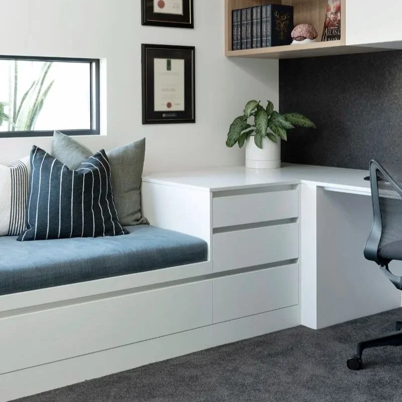 A daybed with blue and white cushions at Arklen's Ardross project.