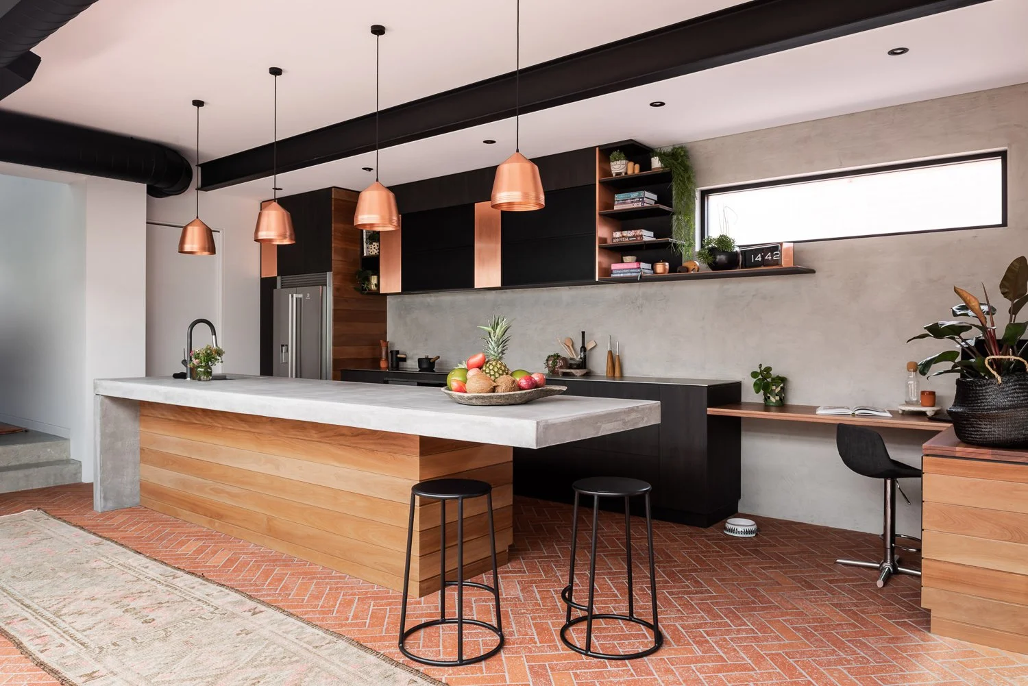 A contemporary kitchen with a low timber bench at an Arklen custom build in Claremont, Perth