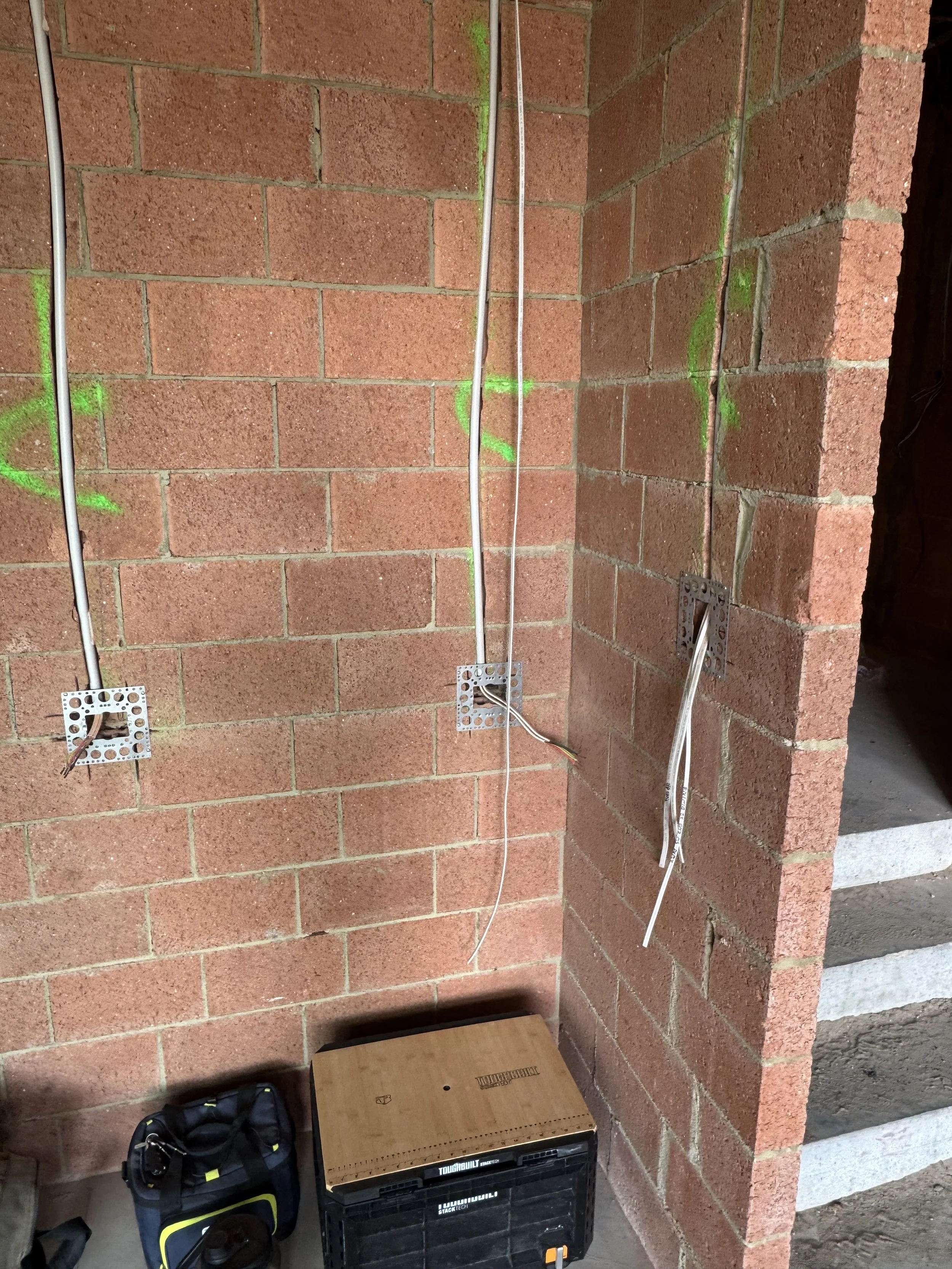 The conduits and wall boxes for the smart light switches.
