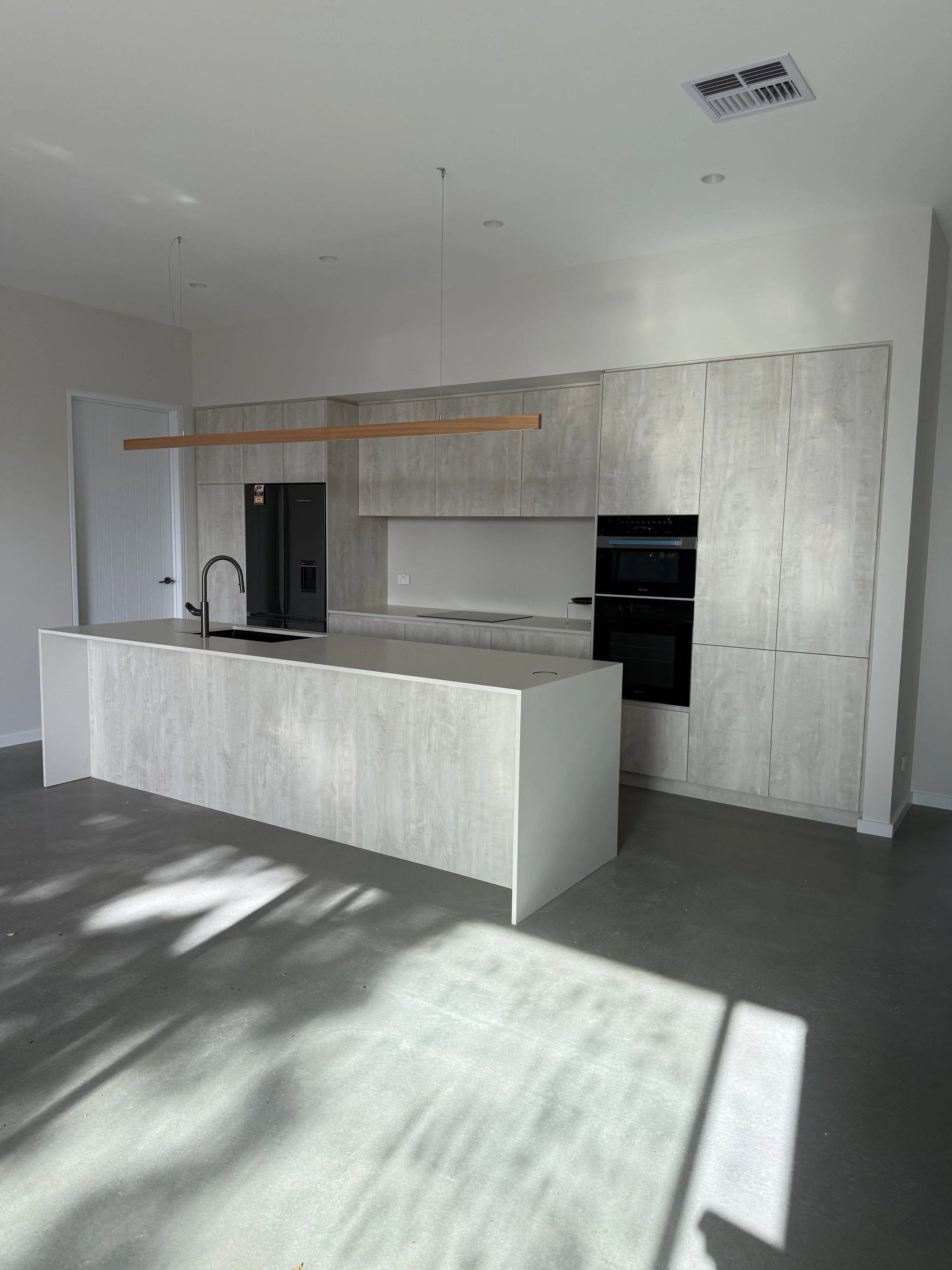 The finished kitchen and one of the bathrooms.