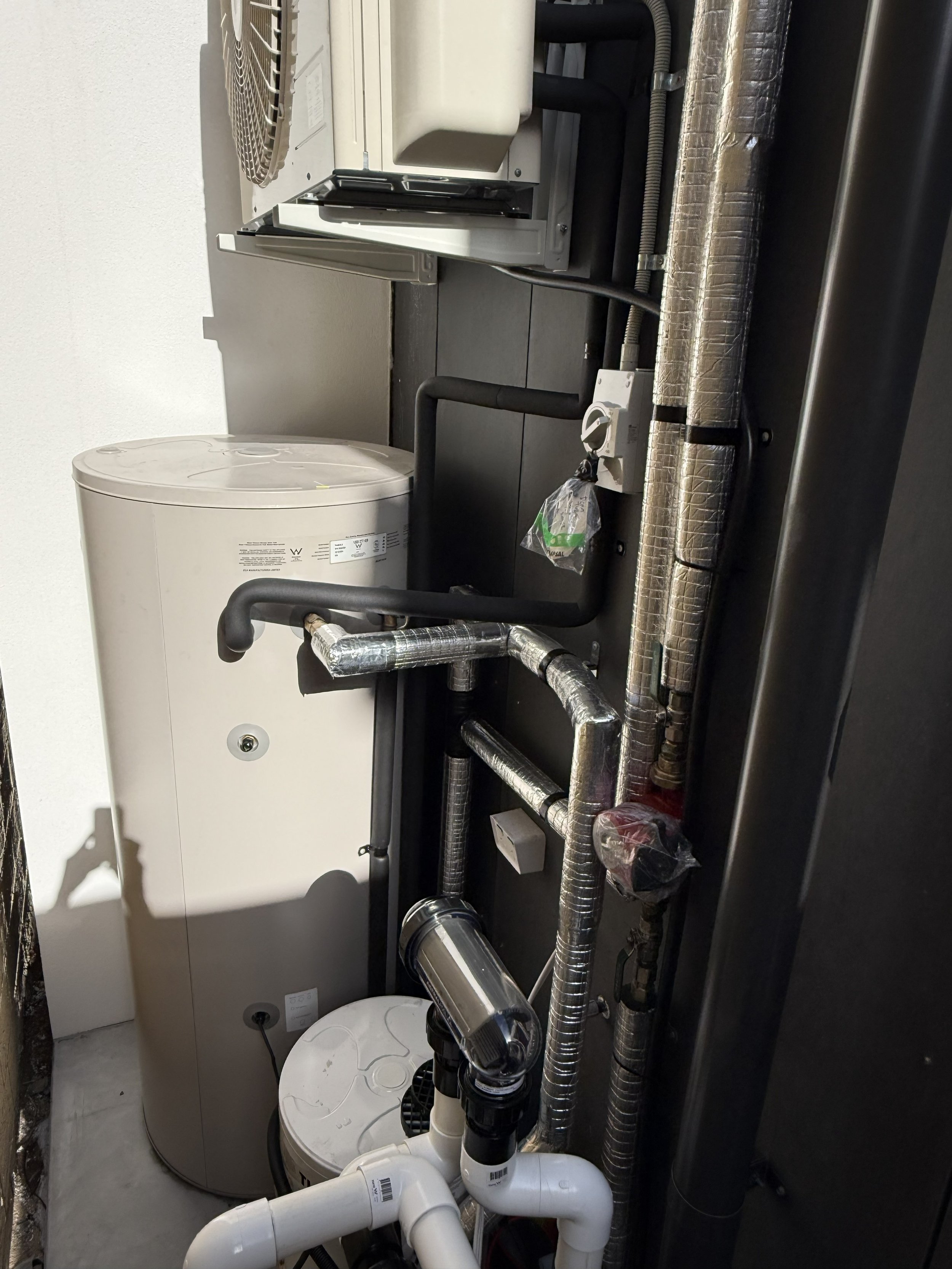 A split system, with an additional buffer tank and insulated pipes for a ring main system. 