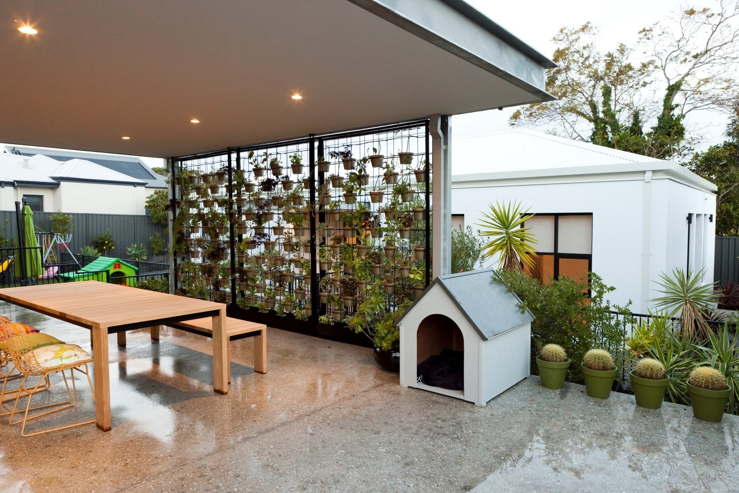 A shot of an alfresco with an ancillary dwelling in the background at Arklen's new home build in Ardross, Perth