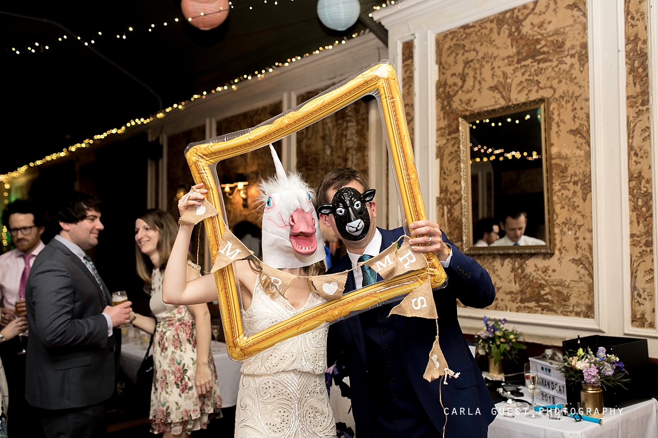unicorn bride and groom wearing masks, winter wedding at Balham bowls club, London wedding