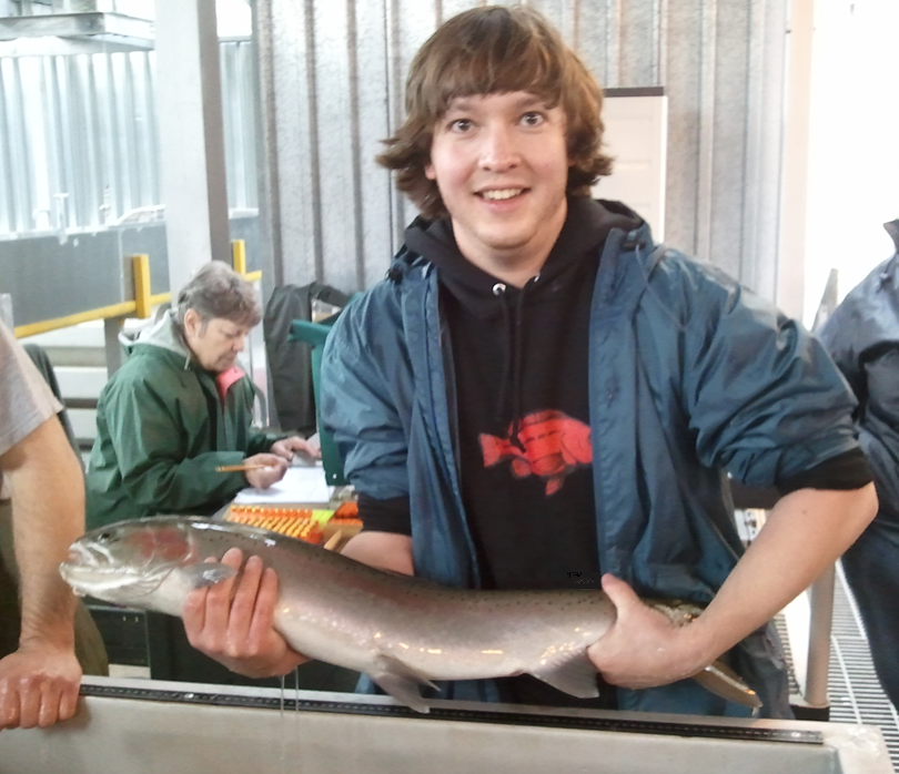 Jesse with hatchery steelhead.png