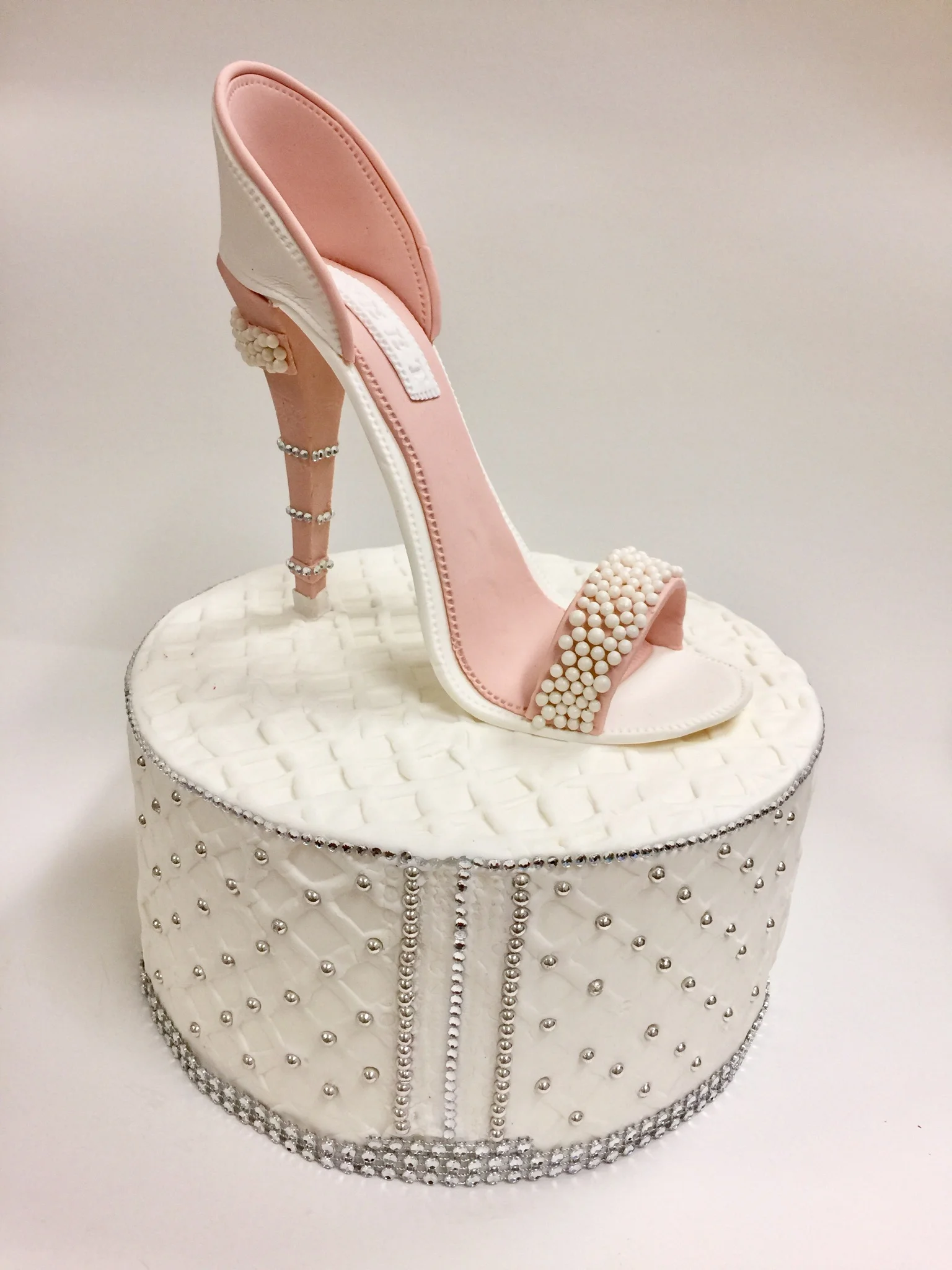 Pink pearl gumpaste shoe with cake.jpg