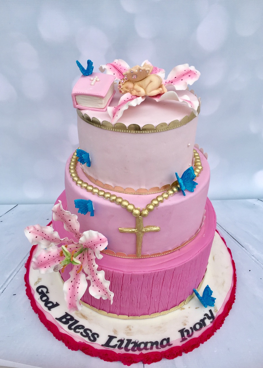 This week we had the pleasure to create a beautiful Baptism cake for baby Liliana Ivory! The cake featured a large tiger lily sugar flower, a sleeping baby, a cascading pink ombre, a gold rosary and beautiful blue butterflies. Congratulations and god bless! 