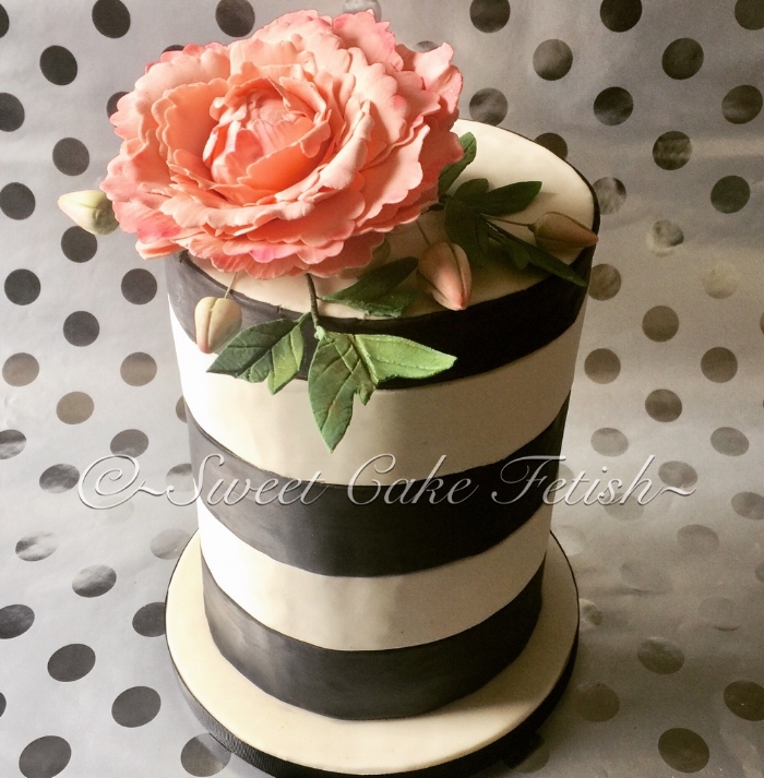 Today's cake was a stunning and simple double barrel black and white striped cake. The cake was topped off with a large pink peony and green sugar leaves. This cake was made for one of our favorite repeat clients from Fort Lee, NJ. Thank you again for all your support! 
