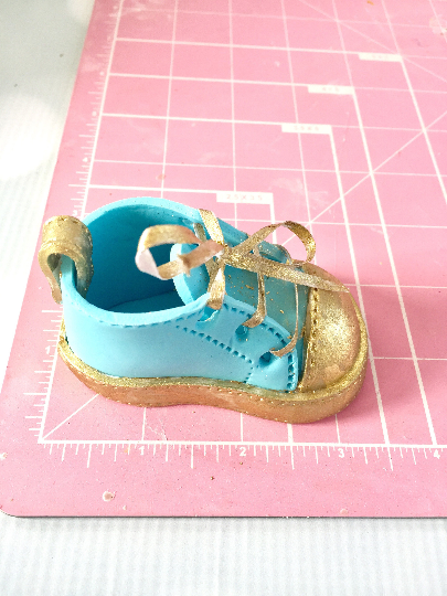 Gold and blue baby gumpaste shoes3.png