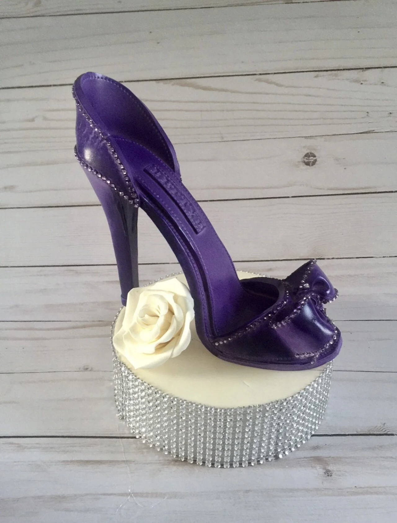 This is a handmade Purple high heel shoe made from gumpaste and non-edible rhinestones to be used as a cake topper. Good for any Birthday, Bridal and Wedding Custom Cakes at any Celebration