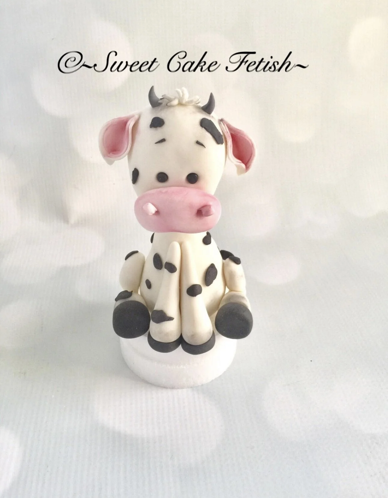This is a handmade baby Cow made from gumpaste to used as a cake topper. Good for Farm Custom cakes or custom cupcakes