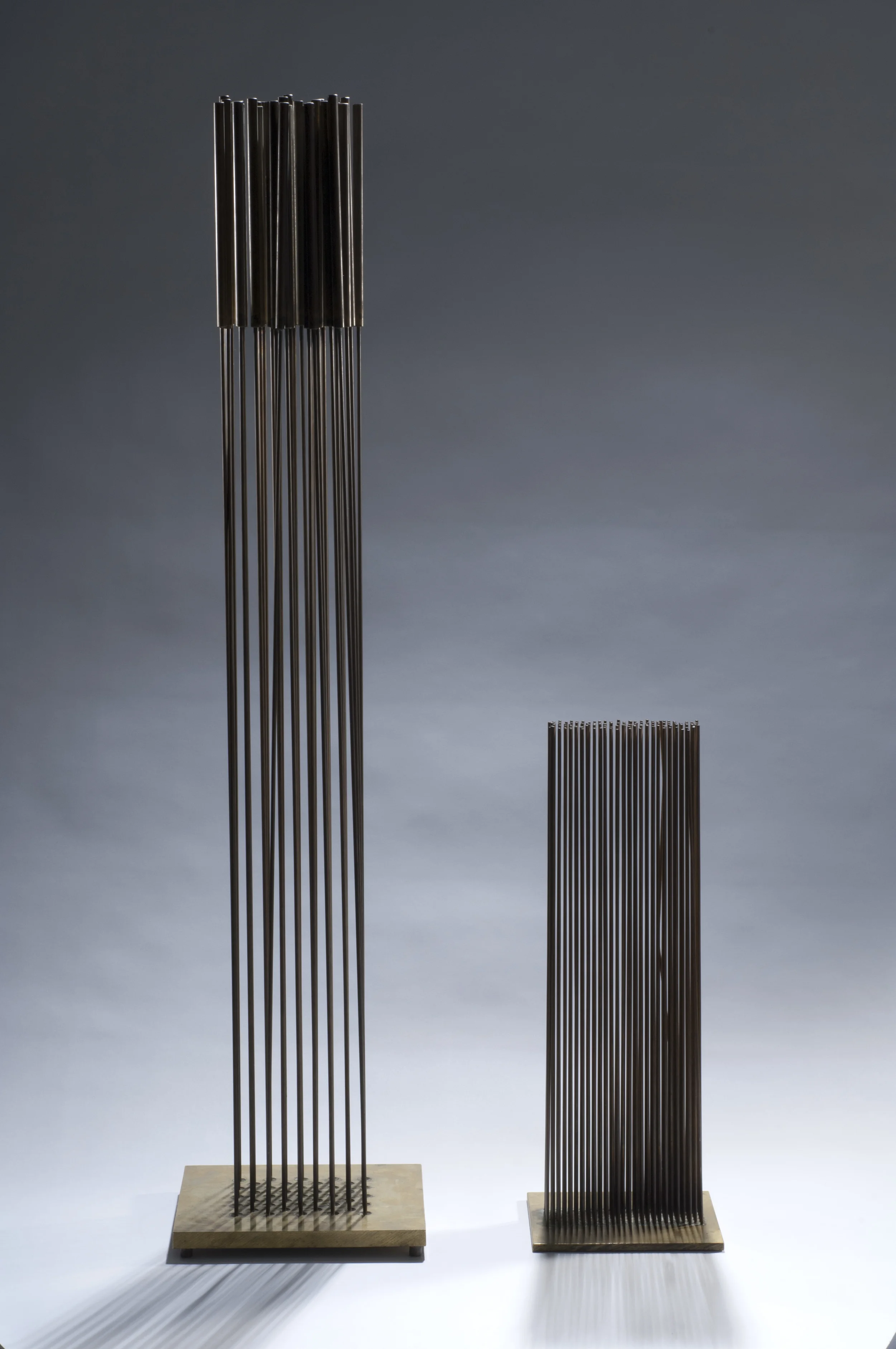 LEFT: SOLD Sonambient, c. 1960s , copper on bronze, 36 3/4 x 7 3/4 x 7 3/4 inches RIGHT: Sonambient (Eleven Rows) , Beryllium copper and brass, 16 x 2 x 5 inches