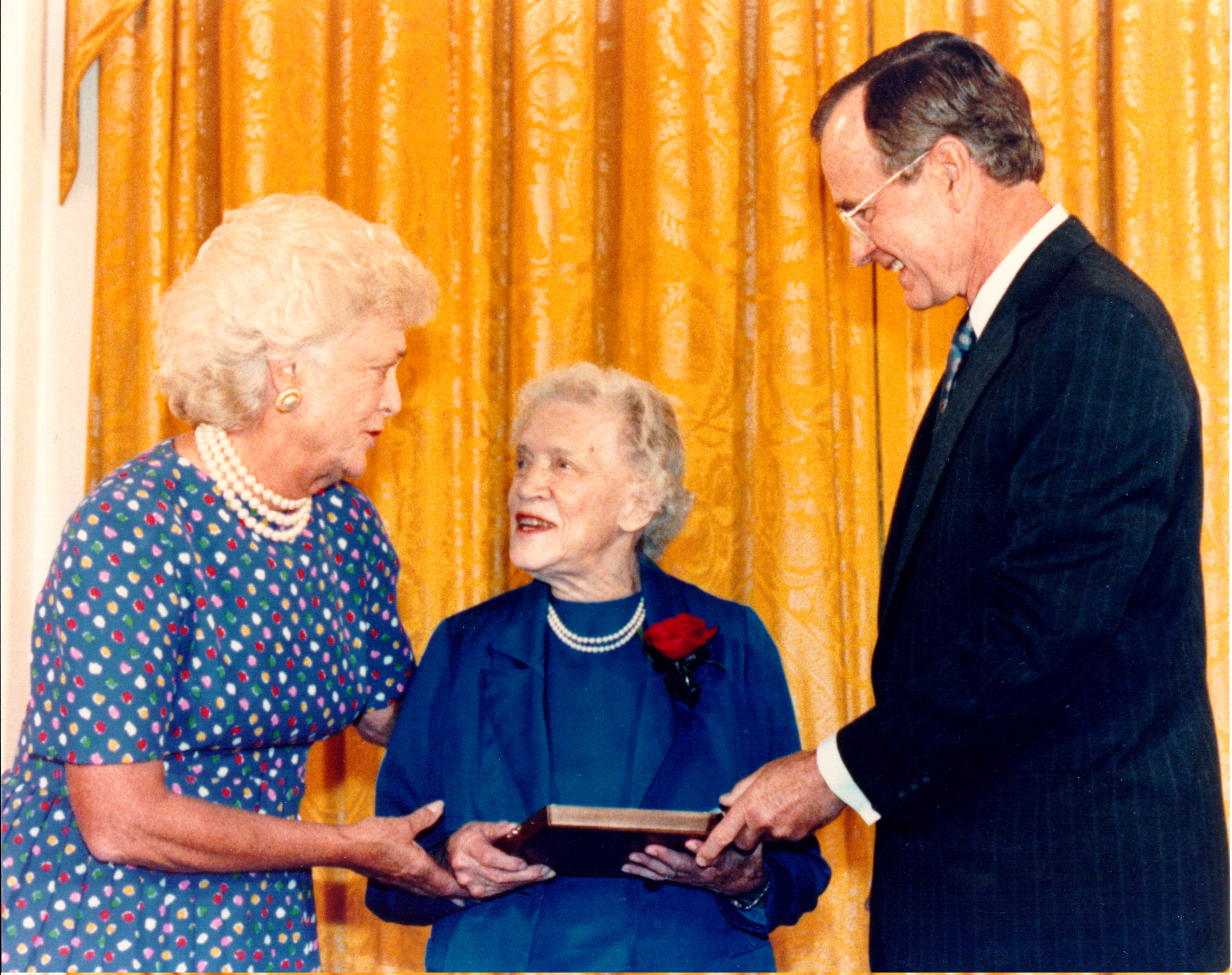 1989: Accepts the Presidential Medal of Freedom from President George H. W. Bush at a White House ceremony.