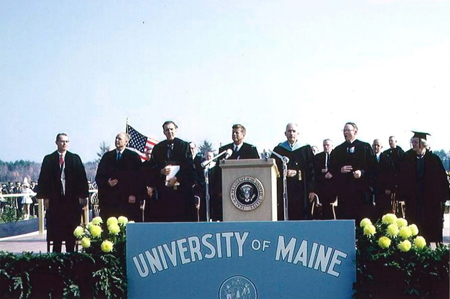 #OTD in 1963, John F. Kennedy, the 35th President, received an honorary degree from the University of Maine. He was on stage with Governor John Reed, Senators Edmund Muskie and Smith, and Representatives Stanley Tupper and Clifford McIntire.